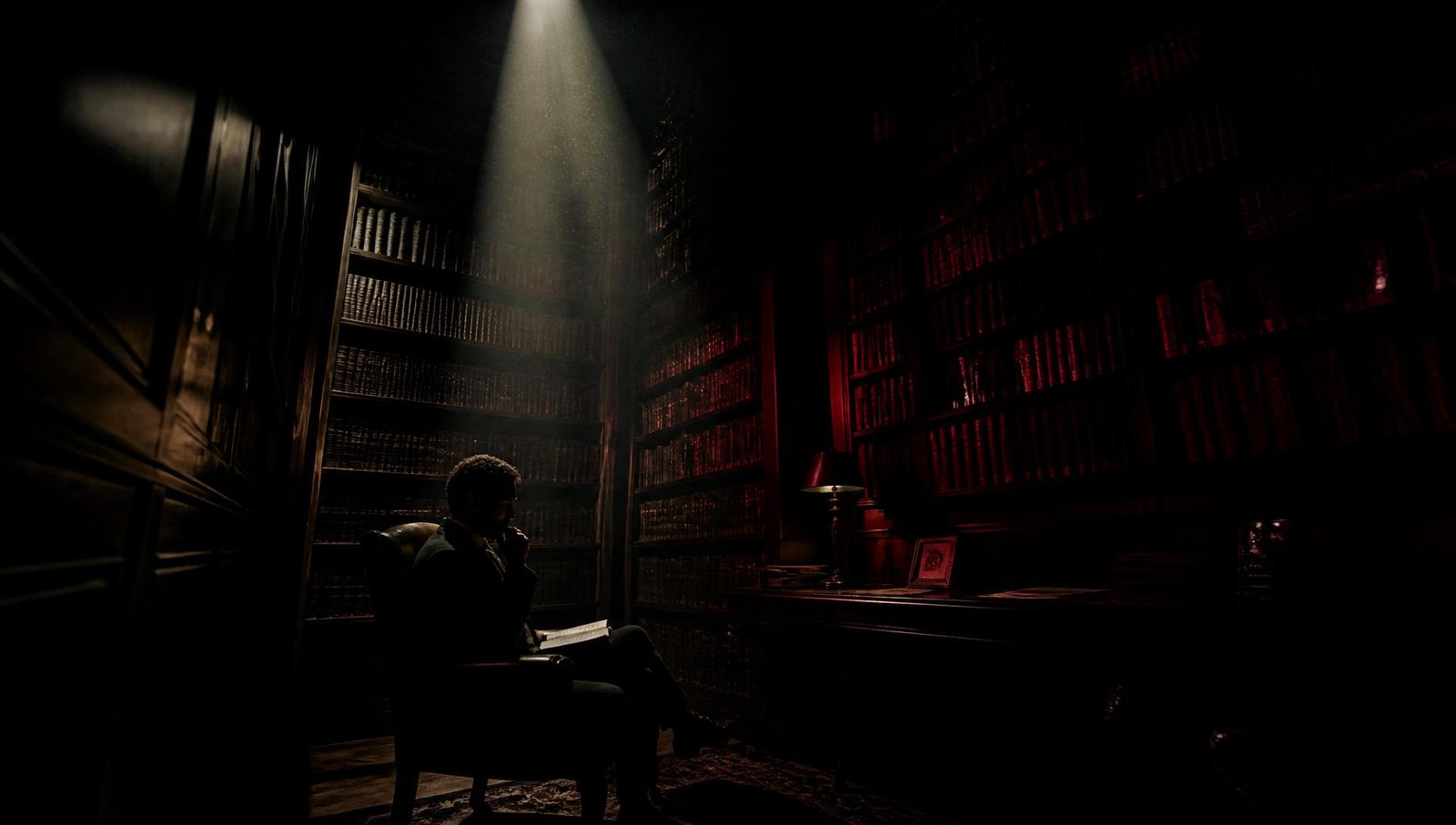 A reader in a dark library lit by a single shaft of light